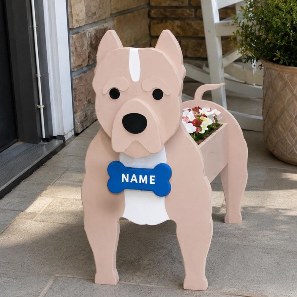 American Staffordshire Terrier dog planter filled with fresh flowers is placed in the garden