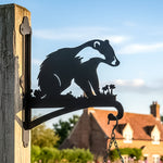 Badger metal hanging basket bracket mounted on outdoor wall for plant decoration