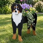 Bernese Mountain dog planter filled with fresh flowers is placed in the garden