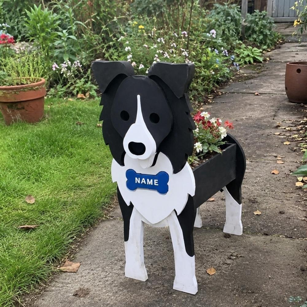 Border Collie dog planter filled with fresh flowers is placed in the garden