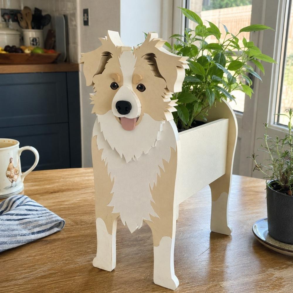 Border Collie dog planter filled with fresh flowers is placed on the table