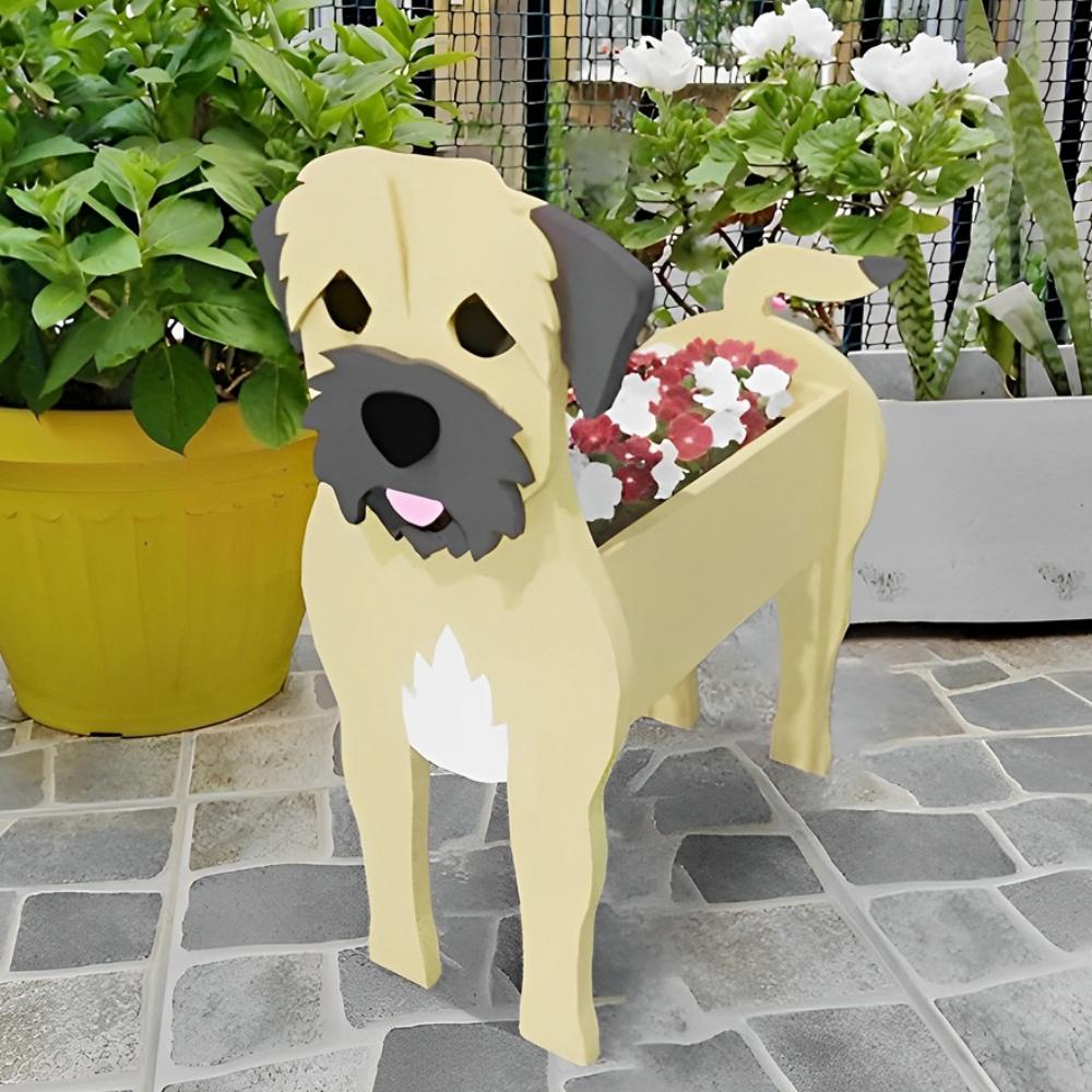 Border Terrier dog planter filled with fresh flowers is placed in the garden