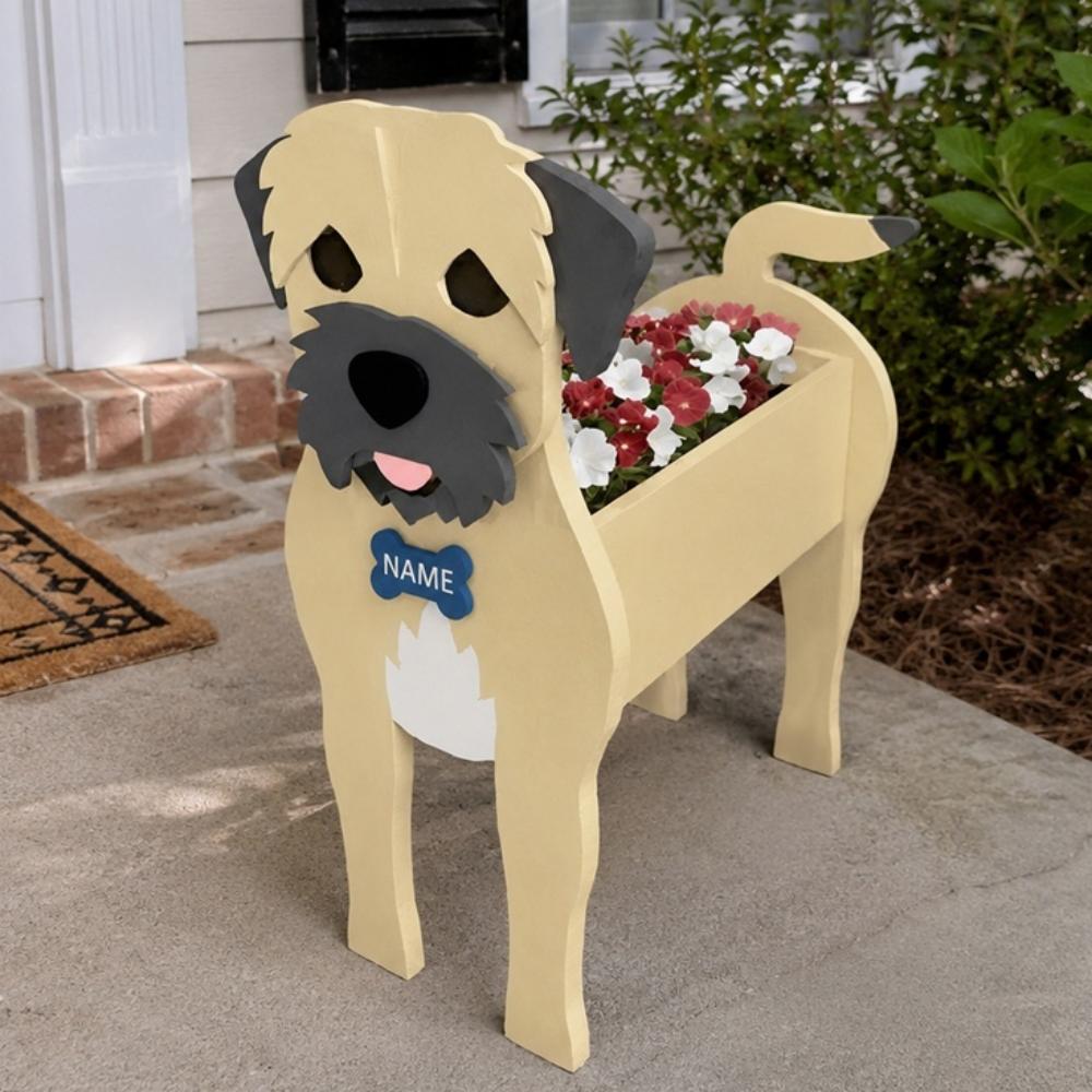 Border Terrier dog planter filled with fresh flowers is placed in the garden