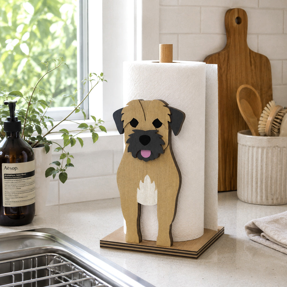 Border Terrier Wooden Dog Paper Towel Holder displayed on a kitchen countertop with a freestanding paper towel roll