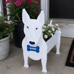 Bull Terrier dog planter filled with fresh flowers is placed in the garden