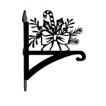 Candy cane and holly metal hanging basket bracket mounted on outdoor wall for plant decoration