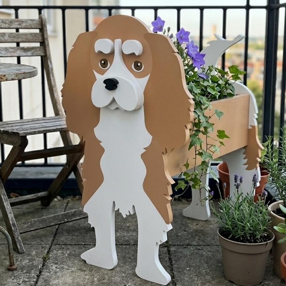 Cavalier King Charles Spaniel dog planter filled with fresh flowers is placed in the garden