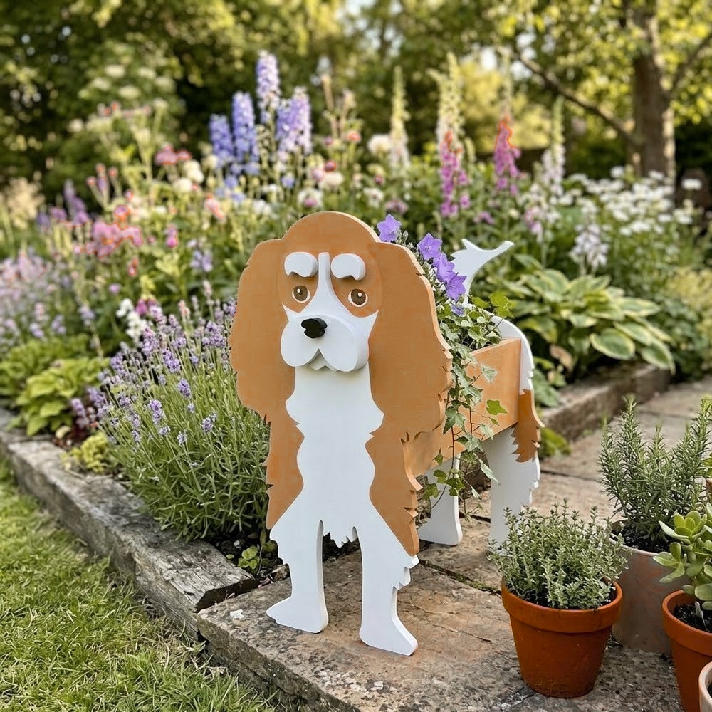 Cavalier King Charles Spaniel dog planter filled with fresh flowers is placed in the garden
