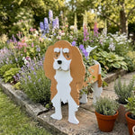Cavalier King Charles Spaniel dog planter filled with fresh flowers is placed in the garden