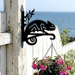 Chameleon lizard on vine metal hanging basket bracket mounted on outdoor wall for plant decoration