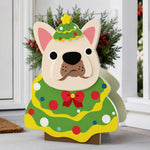 Christmas French Bulldog planter filled with fresh flowers is placed in the garden