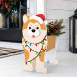 Christmas Shiba Inu dog planter filled with fresh flowers is placed in the garden