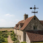 Classic arrow metal weather vane with directional arrows and mounting rod, outdoor roof and garden decoration