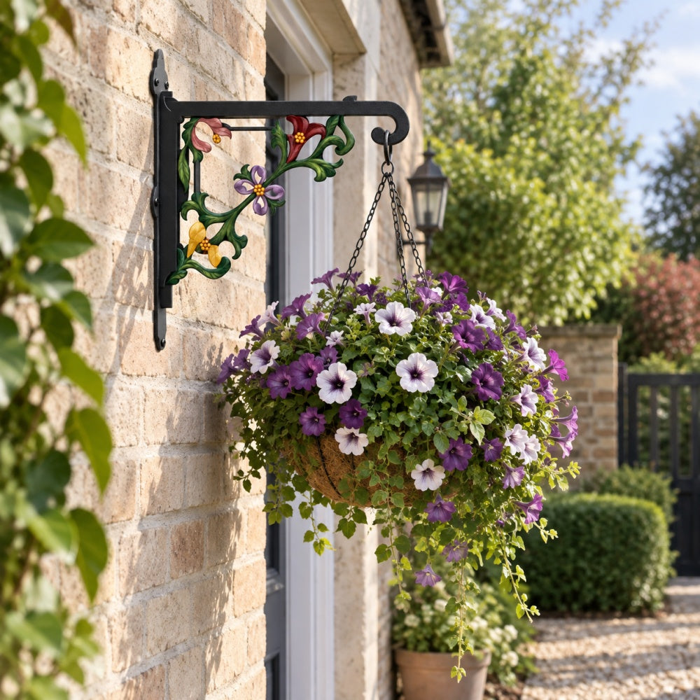 Classic baroque scrollwork metal hanging basket bracket mounted on outdoor wall for plant decoration
