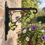 Classic baroque scrollwork metal hanging basket bracket mounted on outdoor wall for plant decoration