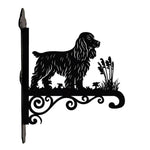 Cocker spaniel metal hanging basket bracket mounted on outdoor wall for plant decoration