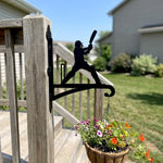 Cricket batsman swinging and wickets metal hanging basket bracket mounted on outdoor wall for plant decoration