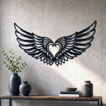 Black metal Cupid Heart wings wall art with intricate cutout details displayed on the wall