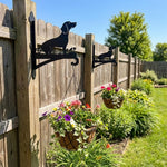 Dachshund metal hanging basket bracket mounted on outdoor wall for plant decoration
