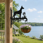 Doberman pinscher metal hanging basket bracket mounted on outdoor wall for plant decoration