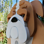 English Bulldog planter filled with fresh flowers is placed in the garden