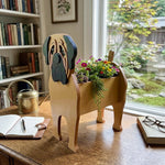 English Mastiff Planter dog planter filled with fresh flowers is placed in the garden