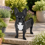 French Bulldog planter filled with fresh flowers is placed in the garden