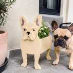 French Bulldog planter filled with fresh flowers is placed in the garden