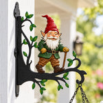 Garden gnome metal hanging basket bracket mounted on outdoor wall for plant decoration