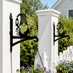 Garden gnome metal hanging basket bracket mounted on outdoor wall for plant decoration