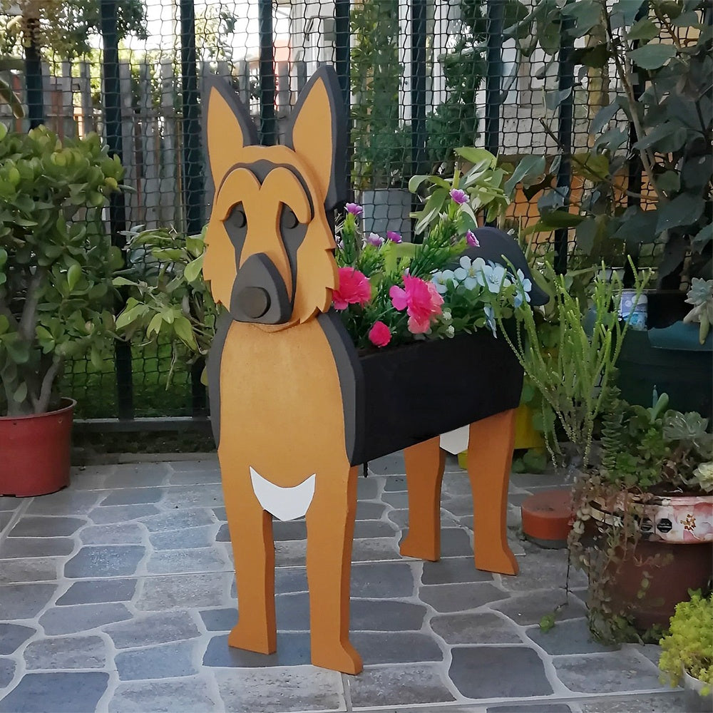 German Shepherd dog planter filled with fresh flowers is placed in the garden