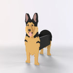German Shepherd dog planter filled with fresh flowers is placed in the garden