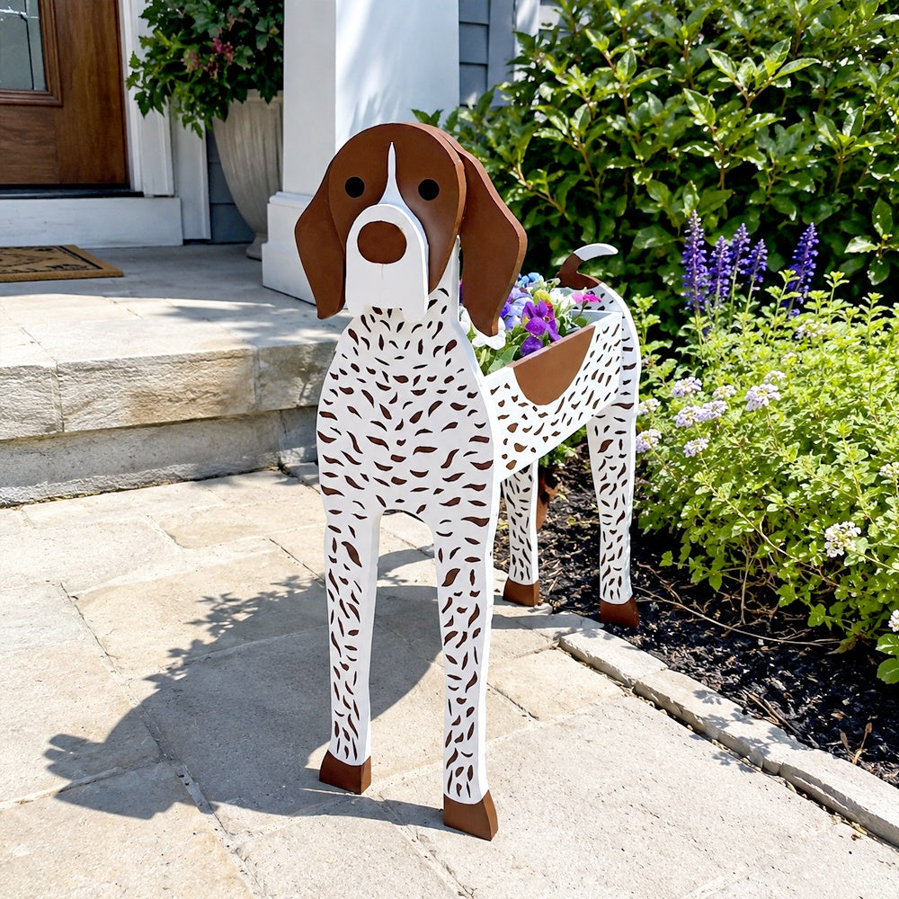 German Shorthaired Pointer dog planter filled with fresh flowers is placed in the garden