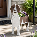 German Shorthaired Pointer dog planter filled with fresh flowers is placed in the garden