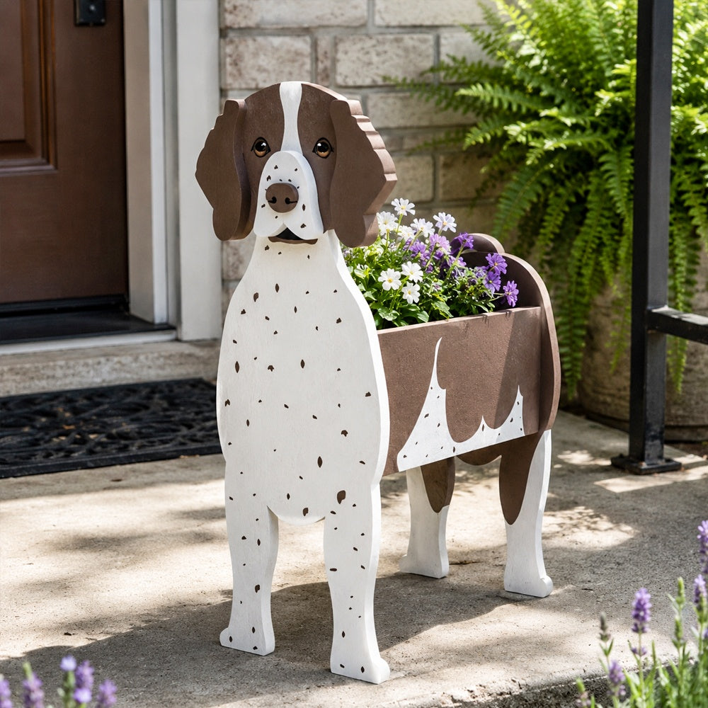 German Shorthaired Pointer dog planter filled with fresh flowers is placed in the garden