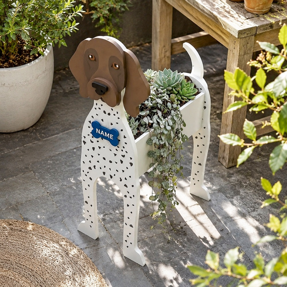German Shorthaired Pointer dog planter filled with fresh flowers is placed in the garden