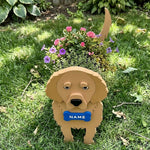 Golden Retriever dog planter filled with fresh flowers is placed in the garden