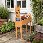 Great Dane dog planter filled with fresh flowers is placed in the garden