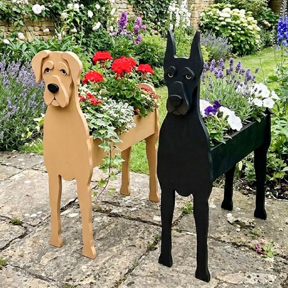 Great Dane dog planters filled with fresh flowers are placed in the garden