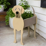 Great Dane dog planter filled with fresh flowers is placed in the garden