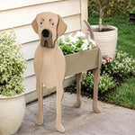 Great Dane dog planter filled with fresh flowers is placed in the garden