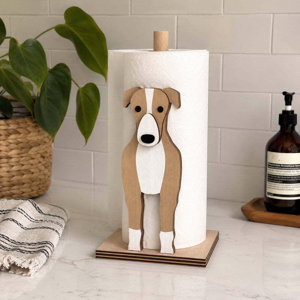 Greyhound Wooden Dog Paper Towel Holder displayed on a kitchen countertop with a freestanding paper towel roll