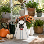 Halloween French Bulldog Planter filled with fresh flowers is placed in the garden