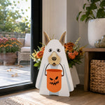 Halloween Ghost Dog Planter filled with fresh flowers is placed in the garden