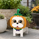 Halloween Shih Tzu Dog Planter filled with fresh flowers is placed in the garden