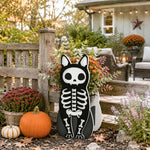 Halloween Skull Cat Planter filled with fresh flowers is placed in the garden