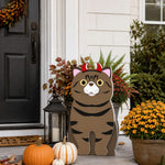 Halloween Tabby Cat Planter filled with fresh flowers is placed in the garden