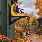 Halloween witch flying on broom metal hanging basket bracket mounted on outdoor wall for plant decoration