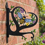 Bee metal hanging basket bracket mounted on outdoor wall for plant decoration