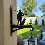 Hunter with dog metal hanging basket bracket mounted on outdoor wall for plant decoration